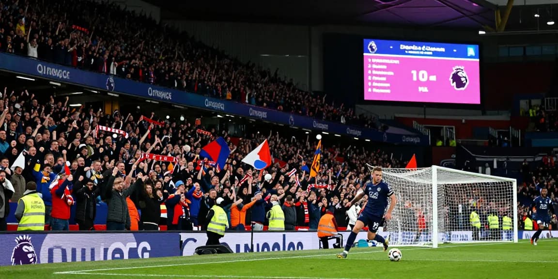 Exciting Premier League match at BK8 featuring fans cheering and players in action.